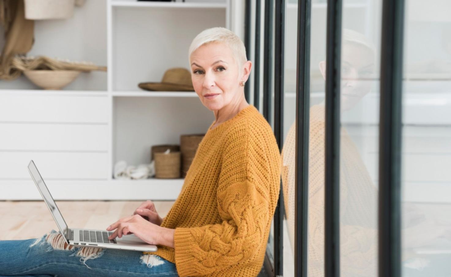 Student working on financial dashboard with multiple screens showing franchise performance data
