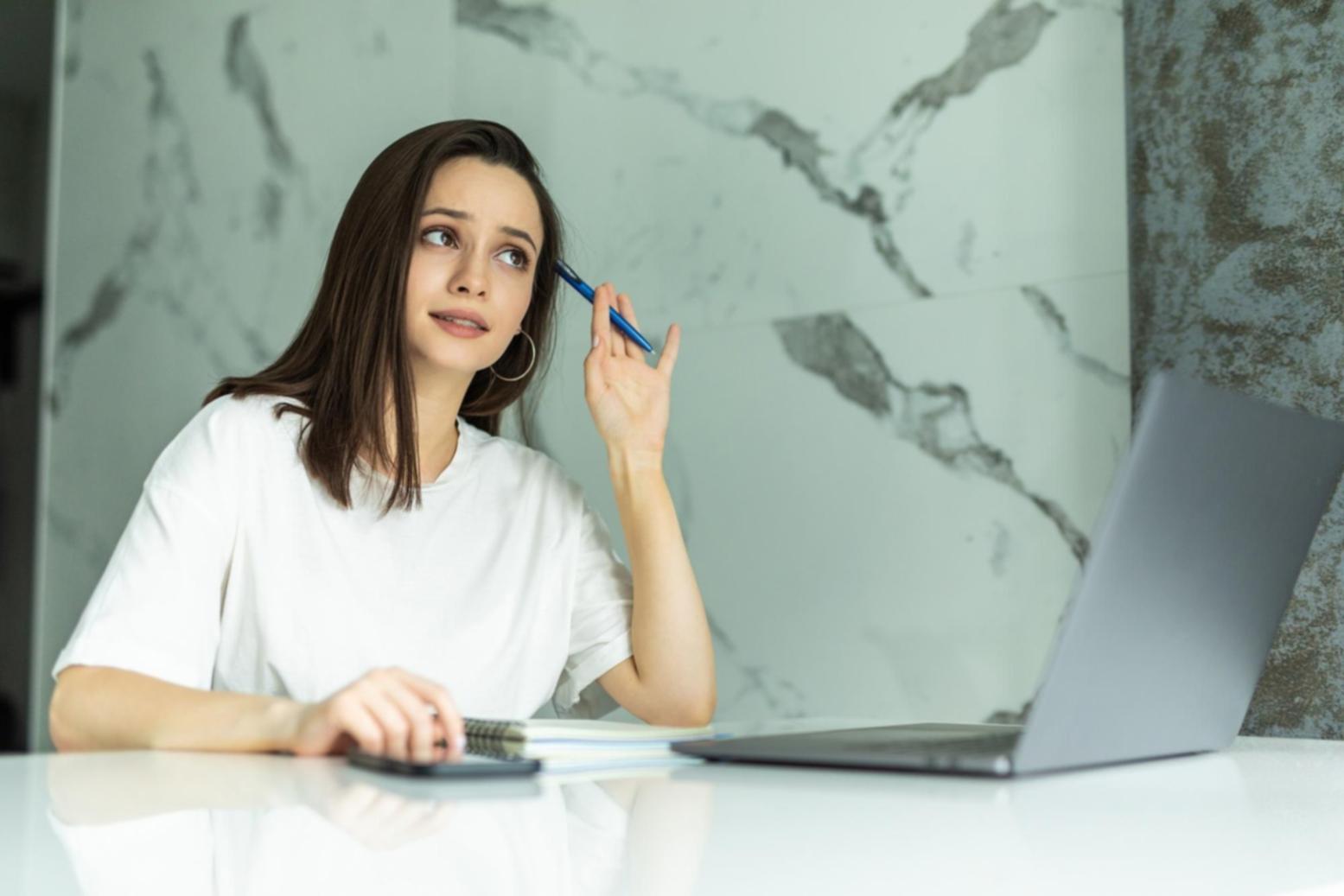 Team collaboration session with students analyzing franchise cost structures on whiteboards